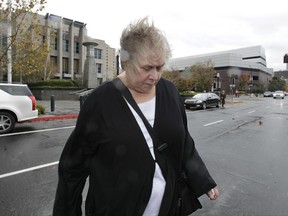 FILE -- In this Nov. 28, 2012 file photo, former Democratic campaign treasurer Kinde Durkee leaves the federal courthouse in Sacramento, Calif., after she was sentenced to more than eight years in federal prison for defrauding high-profile clients, such as U.S. Sen. Dianne Feinstein. Pacific Western Bank has paid $1.75 million to resolve allegations that First California Bank, which PacWest acquired in 2013, violated Section 951 of the Financial Institutions Reform, Recovery and Enforcement Act of 1989 by facilitating the embezzlement scheme of Durkee. (AP Photo/Rich Pedroncelli, file)