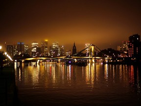 The top of the skyline of the banking district is still in the fog at the Main river in Frankfurt, Germany, early Wednesday, Oct. 25, 2017. (AP Photo/Michael Probst)