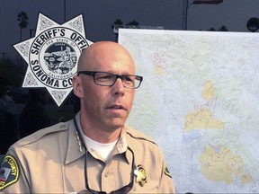 Sonoma County Sheriff Rob Giordano briefs the media at a news conference in Santa Rosa, Calif. on Wednesday, Oct. 11, 2017. Giordano who put the number of people unaccounted for in the hard-hit county at 380, said "We are not switching operations to anything but lifesaving right now, It's all about lifesaving and evacuations," (AP Photo/Paul Elias)
