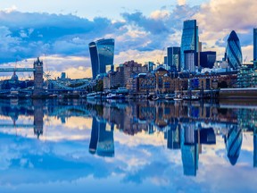 London cityscape and its reflection from river Thames at sunset