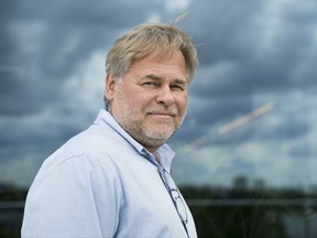FILE - In this July 1, 2017, file photo, Eugene Kaspersky, Russian antivirus programs developer and chief executive of Russia's Kaspersky Lab, poses for a photo on a balcony at his company's headquarters in Moscow, Russia. The founder of Russian anti-virus firm Kaspersky tells The Associated Press his company did upload classified U.S. documents a couple of years ago, only to delete them immediately after realizing what had happened. Kaspersky's acknowledgement is the first on-the-record confirmation of an incident described earlier this month in three U.S. newspapers.(AP Photo/Pavel Golovkin, File)