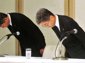In this Oct. 8, 2017 photo,  Kobe Steel's Vice President Naoto Umehara, right, bows during a press conference in Tokyo. The Japanese government is urging steelmaker Kobe Steel to clarify the extent of manipulation of data on steel, aluminum and other metals used in a wide range of products, reportedly including rockets, aircraft and cars. A government spokesman on Wednesday, Oct. 11, 2017,  criticized the apparently widespread falsification of data as "inappropriate," saying it could undermine product safety.  (Kyodo News via AP)