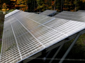 A TransCanada solar array reflects some fall colour at the solar farm alongside County Road 6 on the outskirts of the city on Tuesday, October 4, 2016 in Brockville, Ont.