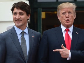 U.S. President Donald Trump, right, welcomes Prime Minister Justin Trudeau to the White House on Wednesday.