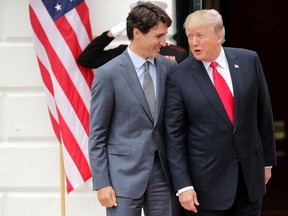 U.S. President Donald Trump (R) and Canadian Prime Minister Justin Trudeau after Trudeau's arrival at the White House October 11, 2017 in Washington, DC.