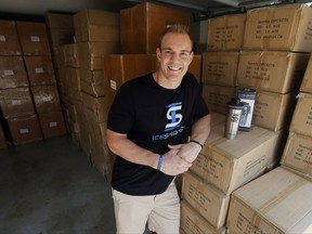 In this Thursday, Aug. 31, 2017, photo, former NFL fullback Chris Gronkowski poses with boxes of his product, Ice Shaker, stacked in his garage, in Colleyville, Texas. For business advice, Gronkowski turned to his father, who'd had his own company for 26 years. He helped shore up Gronkowski's confidence and also gave him some realistic advice. (AP Photo/Tony Gutierrez)