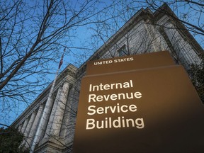 FILE -This April 13, 2014 file photo shows the headquarters of the Internal Revenue Service (IRS) in Washington. The Trump administration has settled lawsuits with dozens of tea party groups who said they received extra, often burdensome scrutiny when applying for tax-exempt status.  (AP Photo/J. David Ake, File)