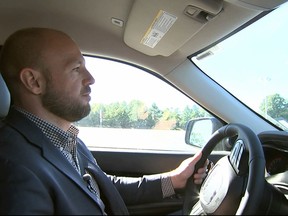 In this image from video, Jake Nelson, AAA's director for traffic safety advocacy and research drives one of the test vehicles used in the study in Washington, Wednesday, Oct. 4, 2017. Infotainment technology automakers are cramming into the dashboard of new vehicles is making drivers take their eyes off the road and hands off the wheel for dangerously long periods of time, a study being released by AAA on Oct. 5 says. (AP Photo/Bill Gorman)