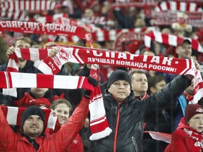 Spartak Moscow fans hold up their teams colors prior to the start of the Champions League group E soccer match between Spartak Moscow and Sevilla at the Otkrytiye Arena in Moscow, Russia, Tuesday, Oct. 17,2017.(AP Photo/Pavel Govolkin)