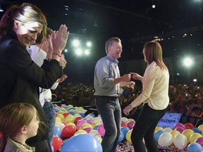 In this photo picture released by the Cambiemos Party, Argentina's President Mauricio Macri, center, dances with Buenos Aires Gov. Maria Eugenia Vidal, right, as his wife Juliana Awada claps after midterm legislative elections in Buenos Aires, Argentina, Sunday, Oct. 22, 2017. Macri's governing coalition won strong support in early results from Sunday's congressional elections and appeared headed to its first legislative majority since he took office in 2015. (Cambiemos Party via AP)