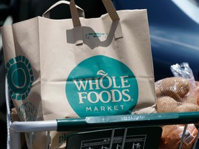 Lower prices at Whole Foods include deeper discounts on some items for Amazon Prime members and come on top of price cuts already announced in August, when Amazon completed its $13.7 billion acquisition of the upscale grocer.