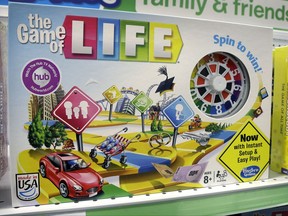 FILE - In this Nov. 11, 2015 file photo, the Hasbro board game "The Game of Life" rests on a shelf in a toy store in North Attleboro, Mass. A trial begins Thursday, Nov. 16, 2017, in federal court in Los Angeles over who invented the game and who owns the rights to it. (AP Photo/Steven Senne, File)