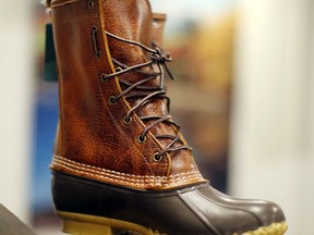 FILE - In this Aug. 17, 2017 file photo, a Bean Boot displayed at the L.L. Bean manufacturing center in Lewiston, Maine, Bean said it's in the midst of another record breaking year of sales for its iconic 'duck boot,' and there will be enough to meet the 2017 holiday crunch. (AP Photo/Robert F. Bukaty, File)