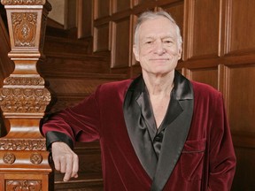 FILE - In this April 7, 2006 file photo, Playboy founder Hugh Hefner poses at the Playboy Mansion in the Holmby Hills area of Los Angeles. Norman Lear, Cindy Crawford, Berry Gordy, Kim Basinger, Bill Maher and the Rev. Jesse Jackson are among the stars offering tributes to Hefner in a special edition of Playboy hitting newsstands this week. "Celebrating Hef" chronicles the Playboy magazine founder's life in words and photos, with the celebrity essays highlighting Hefner's support for civil rights and first-amendment freedoms. (AP Photo/Kevork Djansezian, File)