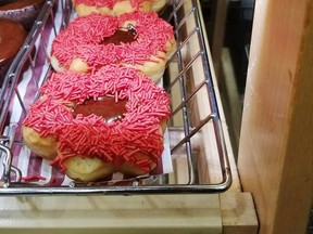 A poppy donut is seen at a Tim Hortons in Calgary in this undated handout photo. The head of the Calgary Poppy Fund and Veterans' Food Bank says he hopes no one gets in big trouble over a poppy-emblazoned doughnut sold at a local Tim Hortons. THE CANADIAN PRESS/HO, Twitter, @crackmacs *MANDATORY CREDIT*