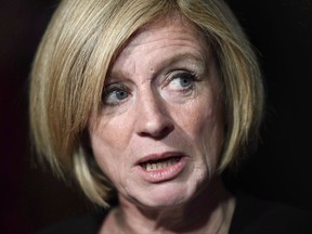 Alberta Premier Rachel Notley will go on tour starting Nov. 20 to stump for the Trans Mountain pipeline, but is resisting opposition calls to wield a big stick against its opponents. Notley speaks to reporters following a Council of the Federation meeting in Ottawa on Tuesday, Oct. 3, 2017. THE CANADIAN PRESS/Justin Tang