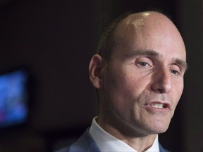 The government will unveil the fine details today of promised changes to parental leave rules that will allow new parents up to 18 months of leave after the birth of a child. Jean-Yves Duclos, minister of Families, Children and Social Development, talks with reporters as the Liberal cabinet meets in St. John's on Wednesday, Sept. 13, 2017. THE CANADIAN PRESS/Andrew Vaughan