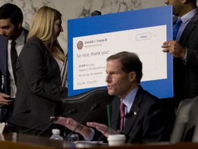 Sen. Richard Blumenthal, D-Conn., center, speaks next to a poster depicting a retweet from President Donald Trump that Sen. Patrick Leahy, D-Vt., said was a retweet from an account that spreads factually incorrect information as Facebook's General Counsel Colin Stretch, Twitter's Acting General Counsel Sean Edgett, and Google's Law Enforcement and Information Security Director Richard Salgado, testify during a Senate Committee on the Judiciary, Subcommittee on Crime and Terrorism hearing on Capitol Hill in Washington, Tuesday, Oct. 31, 2017, on more signs from tech companies of Russian election activity. Also pictured is Sen. Dianne Feinstein, D-Calif., second from left, and, Sen. Patrick Leahy, D-Vt., right. (AP Photo/Andrew Harnik)