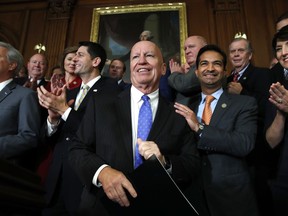 House Ways and Means Chair Rep. Kevin Brady, R-Texas, center, is welcomed by House Republicans including from left, House Majority Leader Kevin McCarthy of Calif., House Speaker Paul Ryan of Wis., Rep. Carlos Curbelo, R-Fla., and Rep. Cathy McMorris Rodgers, R-Wash., as they arrive to speak to the media following a vote on the GOP tax bill, Thursday, Nov. 16, 2017, on Capitol Hill in Washington. (AP Photo/Jacquelyn Martin)