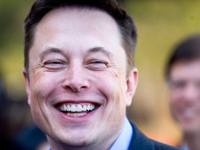 Tesla Chief Executive Elon Musk has promised to unveil an electric semi truck on Thursday that will drive like a sports car and beat its diesel counterpart in a tug of war.