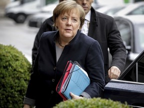 German Chancellor Angela Merkel arrives for the coalition talks between her Christian Democrats and Free Democratic party FDP and the Green party in Berlin Monday, Nov. 13, 2017. (Kay Nietfeld/dpa via AP)