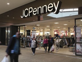 FILE - In this Friday, March 17, 2017, file photo, shoppers exit a J.C. Penney store in the Georgia Square Mall in Athens, Ga. J.C. Penney Co. Inc. reports earnings Friday, Nov. 10, 2017. (John Roark/Athens Banner-Herald via AP, File)