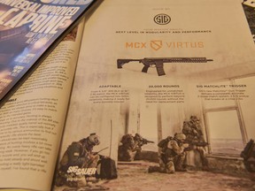 In this photo taken Thursday, Nov. 16, 2017, a magazine advertisement for an AR-style firearm describes the ability to customize the firearm and shows soldiers in combat. AR-platform firearms are often marketed using words that emphasizes the firearm's ability to be customized and evoke a sense of patriotism, freedom and military strength. (AP Photo/Lisa Marie Pane)