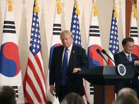 President Donald Trump, left, leaves a joint news conference with South Korean President Moon Jae-in, right, at the Blue House in Seoul, South Korea, Tuesday, Nov. 7, 2017. President Trump, on his first day on the Korean peninsula, signaled a willingness to negotiate with North Korea to end its nuclear weapons program, urging Pyongyang to "come to the table" and "make a deal." (AP Photo/Andrew Harnik)