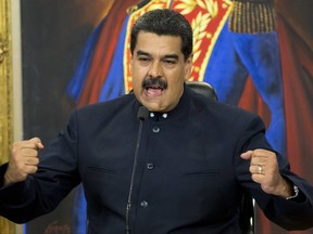 FILE - In this Oct. 17, 2017 file photo, Venezuela's President Nicolas Maduro speaks during a press conference at the Miraflores presidential palace, in Caracas, Venezuela. The EU on Monday Nov. 13, 2017 banned arms sales to Venezuela and set up a system to slap asset freezes and travel restrictions on Venezuelan officials as it seeks to ramp up pressure on President Nicolas Maduro. The move was decided by EU foreign ministers at talks in Brussels.  (AP Photo/Ariana Cubillos, File)