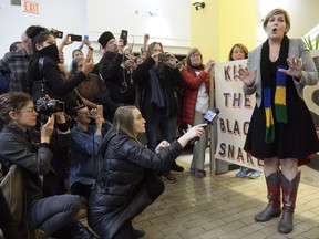 Bold Nebraska Founder Jane Kleeb proclaims a partial victory and vows to continue the fight against TransCanada's Keystone XL pipeline after the Nebraska Public Service Commissioners announced their vote approving the pipeline's "mainline alternative route" through the state Monday, Nov. 20, 2017, in Lincoln, Neb. She says her group believes TransCanada will have to seek another federal review of the route in a process that could take years. (Eric Gregory/The Journal-Star via AP)