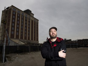 Jason Paris poses for a photograph at the building site of where his condo was supposed to be built in Toronto