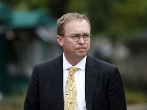 FILE - In this Sept. 13, 2017 file photo, Director of the Office of Management and Budget Mick Mulvaney departs after a television interview at the White House in Washington.  Senior Trump administration officials said Saturday, Nov. 25,  that they expect no trouble when President Donald Trump's pick for temporary director of the Consumer Financial Protection Bureau shows up for work, despite the clash on who should take over.   Trump announced he was picking Mulvaney within a few hours of Richard Cordray's announcement on Friday. (AP Photo/Alex Brandon, File)