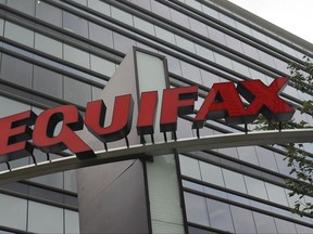 FILE - This July 21, 2012, file photo shows signage at the corporate headquarters of Equifax Inc. in Atlanta.  Equifax says a special committee has determined that four executives did not commit insider trading prior to public disclosure of its massive data breach. The credit rating agency said Friday, Nov. 3, 2017,  that committee found that none of the executives had knowledge of the breach when their trades were made and that preclearance for the trades was obtained properly. (AP Photo/Mike Stewart, File)