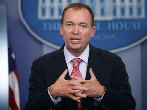 FILE - In this Thursday, July 20, 2017, file photo, Budget Director Mick Mulvaney gestures as he speaks during the daily press briefing at the White House in Washington. Mulvaney and Treasury Secretary Steven Mnuchin sent mixed signals Sunday, Nov. 19, on the fate of a health care provision in the Senate version of a $1.5 trillion measure to overhaul business and personal income taxes that is expected to be voted on after Thanksgiving. "I don't think anybody doubts where the White House is on repealing and replacing Obamacare. We absolutely want to do it," Mulvaney said. (AP Photo/Pablo Martinez Monsivais, File)