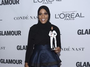 Ibtihaj Muhammad holds a Barbie doll in her likeness at the 2017 Glamour Women of the Year Awards at Kings Theatre on Monday, Nov. 13, 2017, in New York. (Photo by Evan Agostini/Invision/AP)