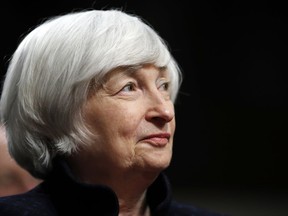 FILE - In this Tuesday, Nov. 7, 2017, file photo, Federal Reserve Chair Janet Yellen listens to introductions as she is awarded the Paul H. Douglas Award for Ethics in Government, on Capitol Hill in Washington. Yellen is submitting her resignation from the Federal Reserve board to President Donald Trump, announcing that she will leave the board when her successor Jerome Powell is sworn is as Fed chairman. Yellen's four-year term as Fed chair ends on Feb. 3, 2018. (AP Photo/Jacquelyn Martin, File)