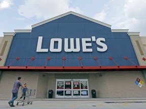 FILE - In this June 29, 2016, file photo, customers walk toward a Lowe's store in Hialeah, Fla. Lowe's Cos., Inc. reports financial results Tuesday, Nov. 21, 2017. (AP Photo/Alan Diaz, File)