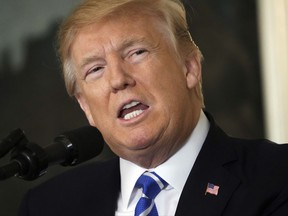 FILE - In this Wednesday, Nov. 15, 2017, file photo, President Donald Trump speaks in the Diplomatic Reception Room of the White House, in Washington. Experts in artificial intelligence are sounding alarms about Trump's "extreme vetting" initiative that proposes using technology to scan social media and automatically make assessments about which foreigners should be allowed to stay in the United States. (AP Photo/Pablo Martinez Monsivais, File)