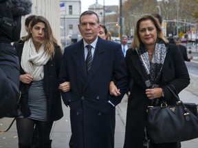 Juan Angel Napout, center, arrives at federal court in the Brooklyn borough of New York, Thursday, Nov. 16, 2017.   Napout, Manuel Burga, and Juan Angel Napout have pleaded not guilty to charges they took part in a 24-year scheme involving at least $150 million in bribes that secured tournament broadcasting and hosting rights in the sprawling FIFA scandal. (AP Photo/Craig Ruttle)
