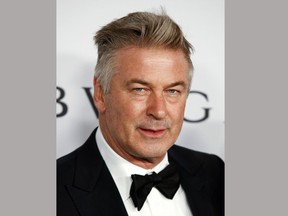 FILE - In this Nov. 7, 2017 file photo, actor Alec Baldwin attends the Elton John AIDS Foundation's 25th Anniversary Gala in New York. Baldwin has settled a lawsuit in which he had accused a prominent New York City art dealer of fraud. The actor tells The New Yorker that gallery owner Mary Boone agreed to write him a "seven-figure check" to settle his allegation that she sold him a copy of a 1996 Ross Bleckner painting called "Sea and Mirror," rather than the original. (Photo by Andy Kropa/Invision/AP, File)