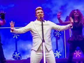 FILE - In this July 9, 2017 file photo, Nick Carter of the Backstreet Boys performs during the Festival d'ete de Quebec in Quebec City, Canada. Carter says he's "shocked and saddened" by accusations made by a singer who said he raped her about 15 years ago. Melissa Schuman of the girl group Dream wrote in a blog post that she was "forced to engage in an act against my will." She said the Backstreet Boy took her virginity. (Photo by Amy Harris/Invision/AP, File)