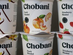 In this Monday, Nov. 20, 2017 photo, Chobani yogurt cups are displayed in New York. Chobani, the company that helped kick-start the Greek yogurt craze, is shrinking those words from its label as it hints it may expand beyond that food in an increasingly crowded yogurt market. (AP Photo/Mark Lennihan)