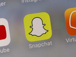 This Wednesday, Aug. 9, 2017, photo shows the Snapchat app. Snap Inc. reports earnings, Tuesday, Nov. 7, 2017. (AP Photo/Richard Drew)