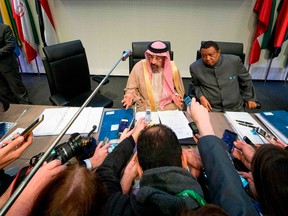 OPEC Conference President Saudi Arabia's Energy Minister Khaled al-Falih (L) and OPEC  Secretary General Mohammed Barkindo speak to journalists at the start of the 173rd OPEC Conference of Organization of the Petroleum Exporting Countries (OPEC) in Vienna, Thursday.