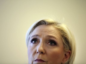 FILE - In this May 2, 2017 file photo, French far-right leader Marine Le Pen delivers a speech during a conference in Paris. Le Pen, says that the party's long-time bank, Societe Generale, has closed its accounts in what amounts to a "banking fatwa" to suffocate it. She said that a legal complaint would be filed against Societe Generale, one of France's largest banks, as well as against HSBC, her personal bank which also allegedly shut her out. (AP Photo/Thibault Camus, File)