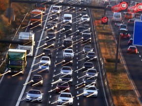 Cars and trucks queue on the highway A5 in Frankfurt, Germany, Monday, Nov. 6, 2017. The World Climate Conference with 25 000 people participating starts on Monday in Bonn, Germany. (AP Photo/Michael Probst)