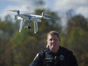 In this Oct. 16, 2017 photo, Streetsboro Officer Scott Hermon pilots the department's first drone in Streetsboro, Ohio. Streetsboro Police became one of hundreds of agencies across the country adopting drone technology when Hermon became the first Streetsboro officer certified to fly drones in October. Streetsboro Police say they can't afford a helicopter, but a drone provides many of the same capabilities at a fraction of the price. (AP Photo/Dake Kang)