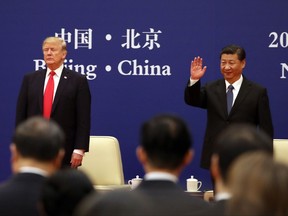 U.S. President Donald Trump, left, and Chinese President Xi Jinping attend a business event at the Great Hall of the People in Beijing, Thursday, Nov. 9, 2017. (AP Photo/Andrew Harnik)