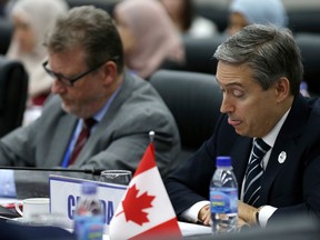 Canadian Minister of International Trade Francois-Philippe Champagne, right, attend a Trans Pacific Partnership (TPP) ministerial meeting on the sidelines of the Asia-Pacific Economic Cooperation (APEC) leaders summit on Thursday, in Danang, Vietnam.
