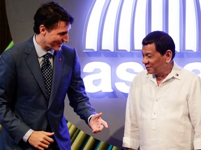 Canadian Prime Minister Justin Trudeau, left, talks to Philippine President Rodrigo Duterte before the opening ceremony of the 31st Association of Southeast Asian Nations (ASEAN) Summit in Manila, Philippines Monday.